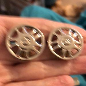 Bright silver clip on Chanel earrings.